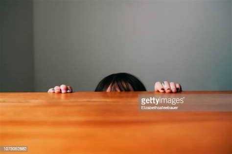 Hiding Behind Table Photos And Premium High Res Pictures Getty Images
