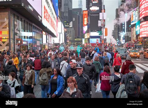 Full Busy Sidewalk In The Evening Evening In Times Square New York City