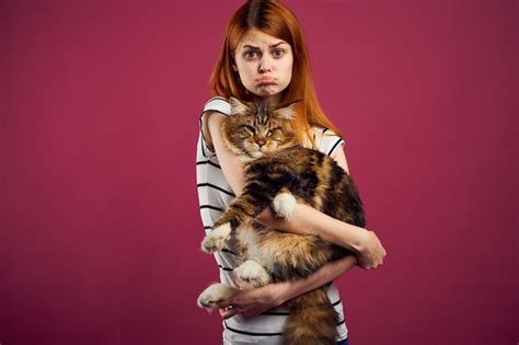 Premium Photo Portrait Of Young Woman Holding Cat