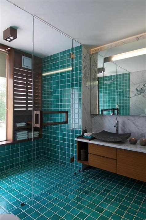 The best tile idea for monochrome bathrooms is to use bright white for walls and statement black tiles for flooring. 20 Functional & Stylish Bathroom Tile Ideas