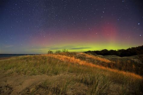 Northern Lights Look Like Waves Rolling Above Great Lakes In This