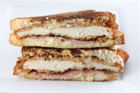 Mound a quarter of the cheese on each piece of chicken, then wrap 2 slices of ham around each breast to cover the cheese. Chicken Cordon Bleu Grilled Cheese Recipe - BlogChef