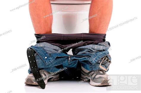 Man Is Sitting On The Toilet Bowl On White Background Stock Photo Picture And Rights Managed