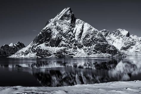 The Epic Snow Covered Mountains Of The Lofoten Islands Reine Norway