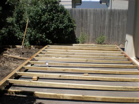 Ground level view of weathered outdoor wood floor. Build DIY Install deck over concrete patio PDF Plans Wooden How To Build A Yard Swing Frame ...