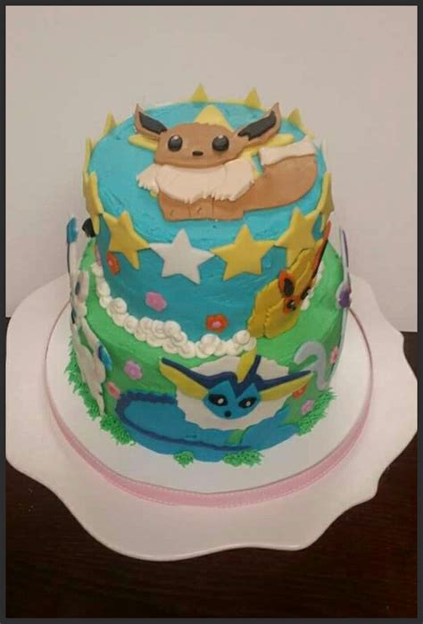 A Birthday Cake Decorated With Pokemon Characters And Stars