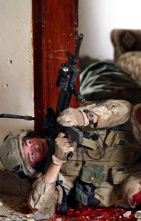 Us Marine Lies In The Blood Of A Dead Insurgent While Covering A