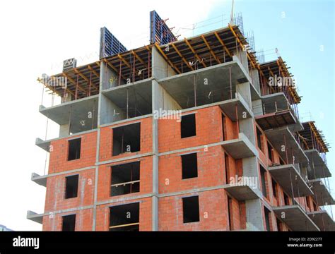 A Multi Storey Apartment Building Is Being Built With Brick And