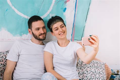Free Photo Couple Taking Selfie In Bed