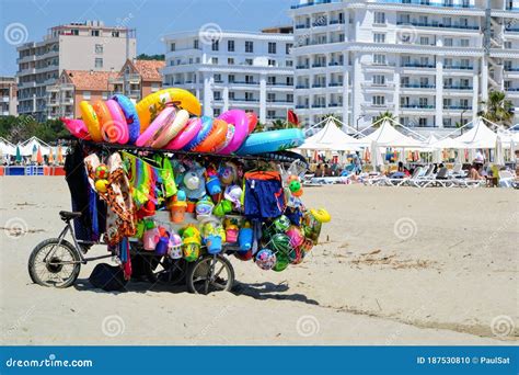 toys seller cart with plastic toys and beach balls on the sandy beach editorial image image of