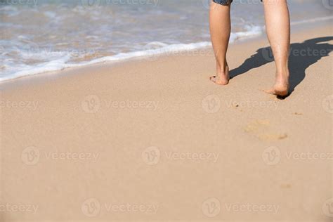 Footprints In The Sand On The Beach Woman Walking To The Sea Stock Photo At Vecteezy