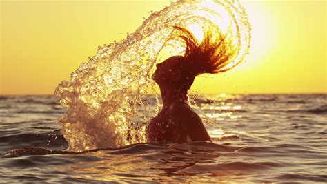 Slow Motion Woman Splashes Water With Her Hair Stock Footage Video