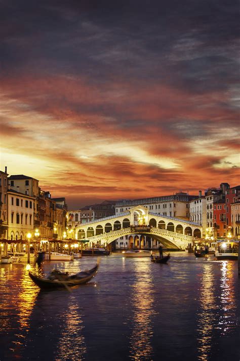 Rialto Bridge At Sunset The Rialto Bridge In Venice Italy Is An Icon