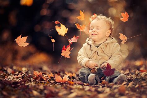 Little Boy Enjoying The Autumn Breeze Hd Wallpaper Background Image