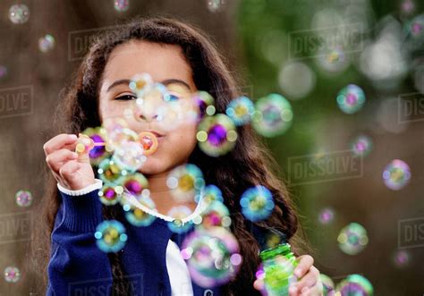 Girl Blowing Bubbles Stock Photo Dissolve