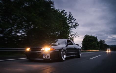 Buy wheels from ozzy tyres today and you can have your nissan skyline r32 looking as good as this! Black coupe with headlight on road, Nissan, skyline ...