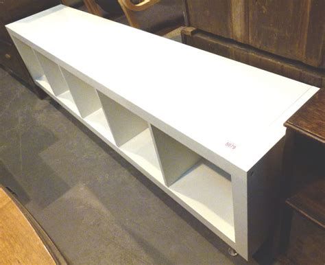 This low storage unit, made from fsc pine, has 2 deep trundle drawers on sturdy castors. White long, low storage unit with five compartments, 1805 ...