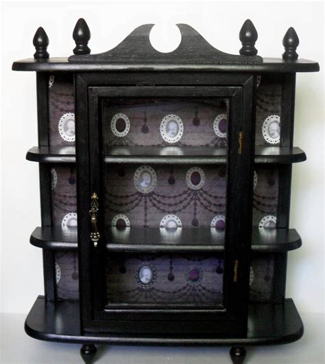 You can use wall mount display cabinets to keep your valuable items in an organized manner. Gothic Curio Cabinet Gothic Home Decor Wall Cabinet