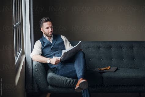 A Man Reading Newspapers By Stocksy Contributor Lumina Stocksy
