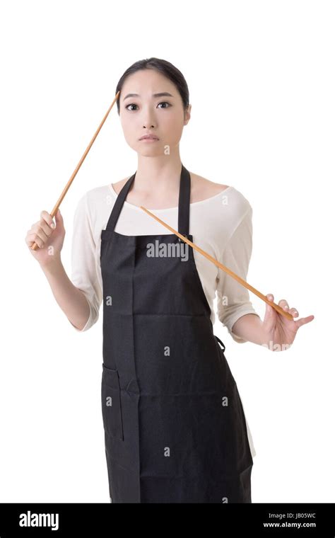 Young Asian Housewife Hold A Chopsticks In Apron Closeup Portrait On