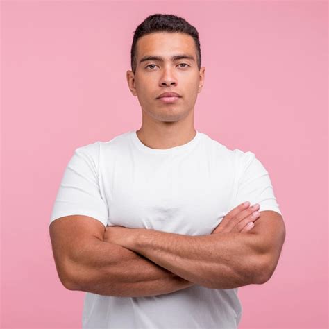 Free Photo Front View Of Handsome Man Posing With His Arms Crossed