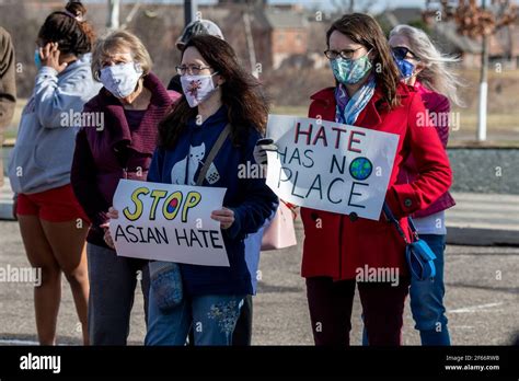 maple grove minnesota march 25 2021 masked protesters at a stop asian hate rally to remember