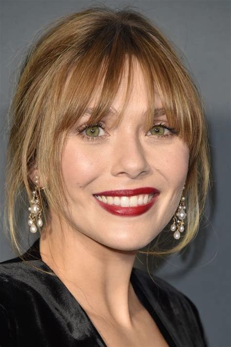 This curly bob with bangs really stands out with help from bright green, but you can choose any color to make yours pop. See The 13 Best Hairstyles With Bangs
