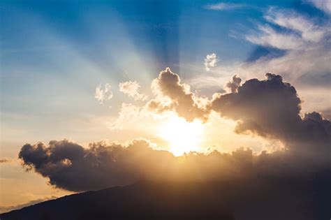 Golden Rays Of The Sun Through The Black Clouds Stock Photo Download
