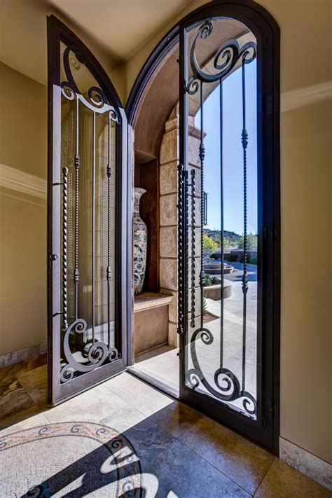 Home Entryway With Tall Glass And Wrought Iron Door A Double Door Makes