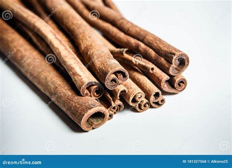 Closeup Big Group Of Dry Cinnamon Sticks Served On White Table Surface