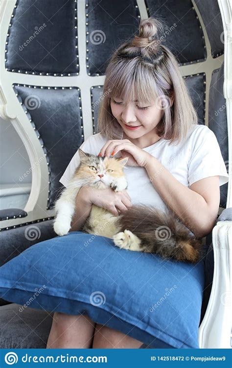 Cat Lover Concept Beautiful Asian Woman Sitting On The Couch And
