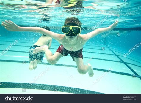 Little Boy Swimming Underwater Looking Camera Stock Photo 29638315
