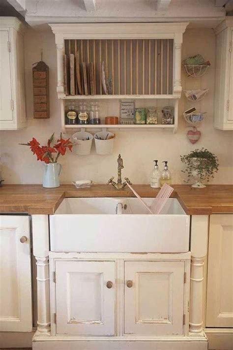A bank of windows are positioned above a farmhouse sink paired with a polished nickel gooseneck faucet mounted above white shaker cabinets and drawers accented with. Épinglé sur Home Ideas & Inspiration