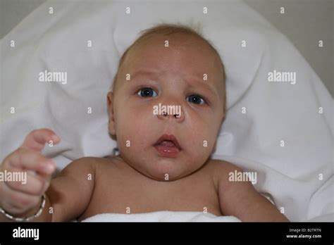 Confused Baby Pointing Finger Stock Photo Alamy