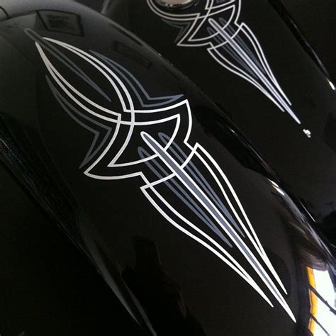 Red And White Pinstripes On Side Of Matte Black Motorcycle Tank