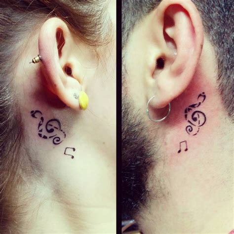 Little Behind The Ear Matching Tattoo Of A Treble Clef And