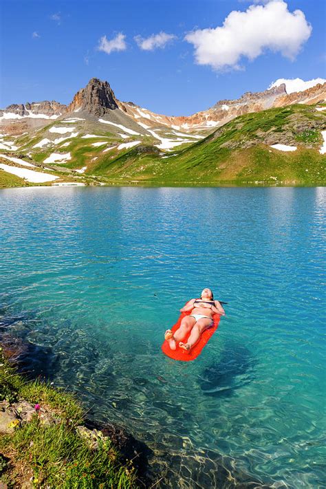 Woman Relaxing On Air Bed In Ice Lake Photograph By Kyle Ledeboer Pixels