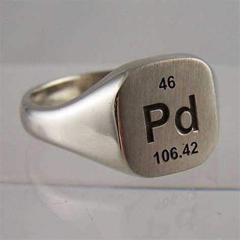 A Silver Signet Ring With The Word Pdd On It