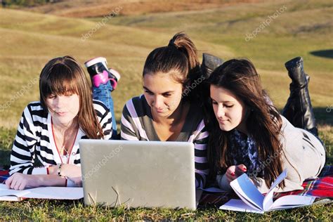 Group Of Teens Working On Laptop Outdoor Stock Photo By ©shock 7941008