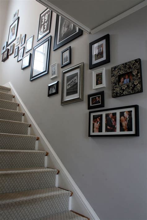 27 stylish staircase decorating ideas. Cornforth White center-hall with photo collage | Modern ...