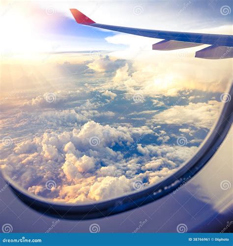 Clouds And Sky As Seen Through Window Of An Aircraft Stock Image