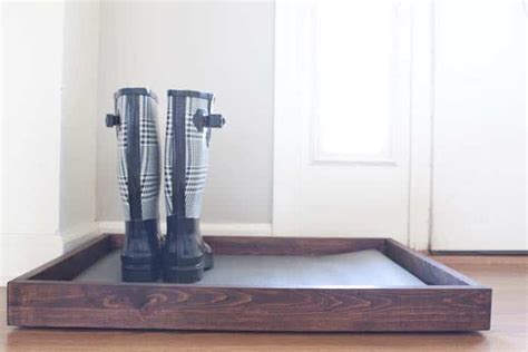 We use a lot of black in our decorating color scheme but there had to be some way to dress it up. DIY Wooden Boot Tray & Shoe Organizer ⋆ Real Housemoms