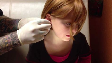 6 year old getting Ears Pierced using Needle Method - YouTube