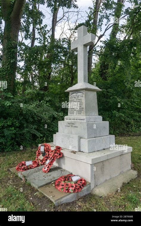 Village War Memorial To The Dead Of Ww1 And Ww2 In The Churchyard Of St
