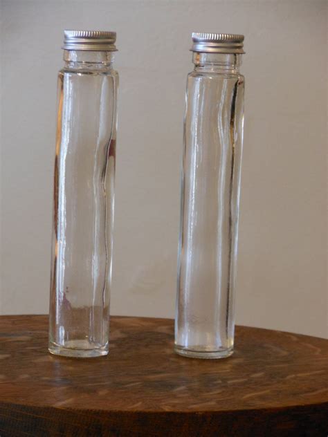 Two Glass Cylinder Containers W Lids