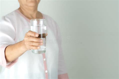 Drinking Water In The Senior Woman S Hand Concept Of Environment