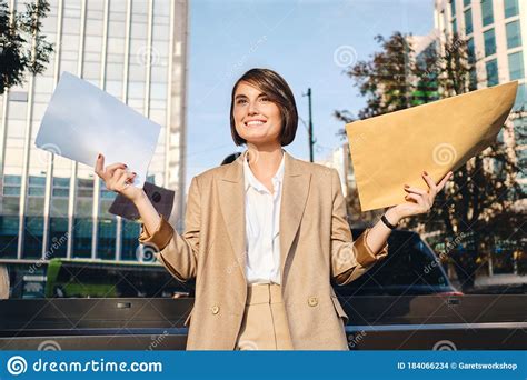 Young Joyful Businesswoman Holding Envelope With Response Happily