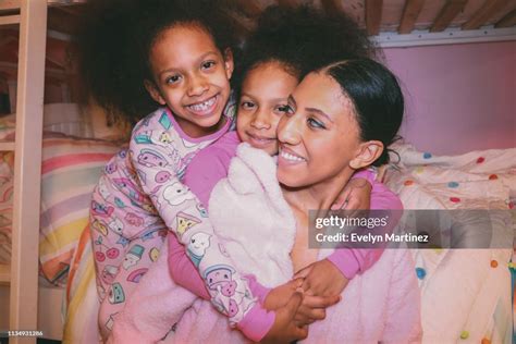Afrolatina Twin Daughters Hugging Afrolatina Mom Everyone Is Smiling