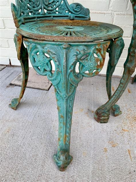 It has lived outside all this time with no cover so a few tint patches of rust but barely noticeable. Antique Green Cast Iron Outdoor Bistro Set, Table and Two ...