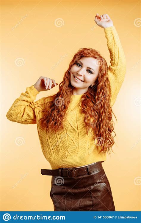 Redhead Woman Dancing With Happiness Face Expression Stock Image